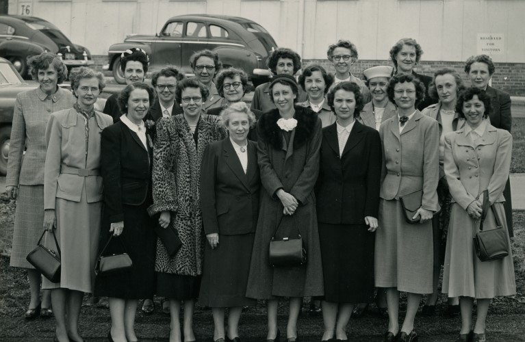 Black and white image of two early founders of ONS, Rosalie Peterson (left center) and Katherine Nelson (right center) with group of nurses outside of the National Cancer Institute, circa 1949.  From MS 1 Early History Nursing Pioneers collection.