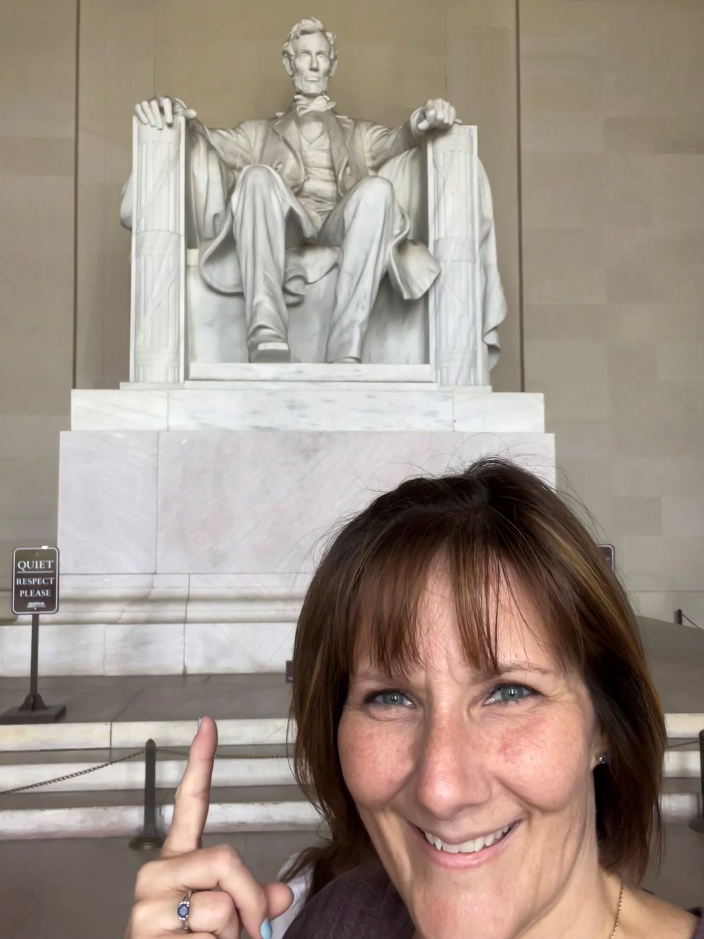 Image of Susanne Carrier in front of the Lincoln Memorial